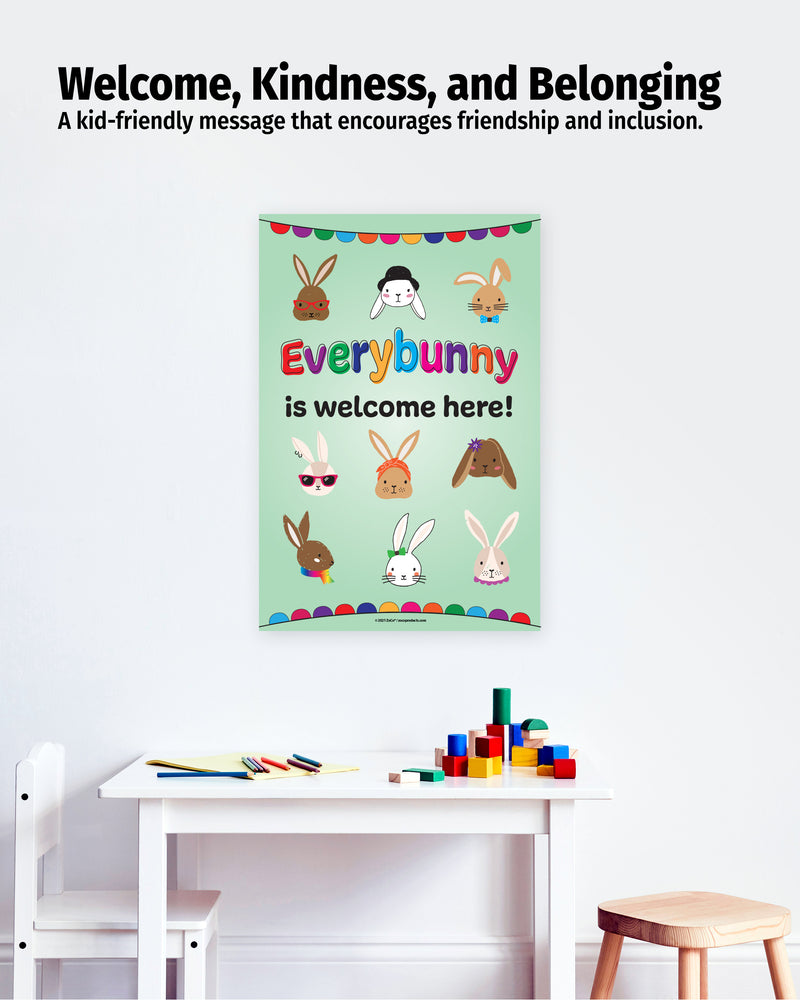 Poster with 'Everybunny is welcome here!' message on a wall above a table with toys.