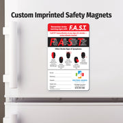 Fridge magnet with F.A.S.T. stroke awareness information on a white refrigerator.