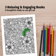 Coloring book with black and white floral design and a green tree, accompanied by colored pencils on a wooden surface.