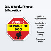 Warning sign with 'Beware of Dog' text on a white background