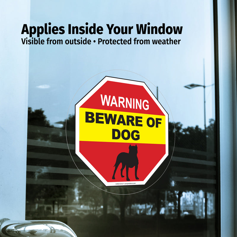 Window decal with 'Beware of Dog' warning sign applied inside a window.