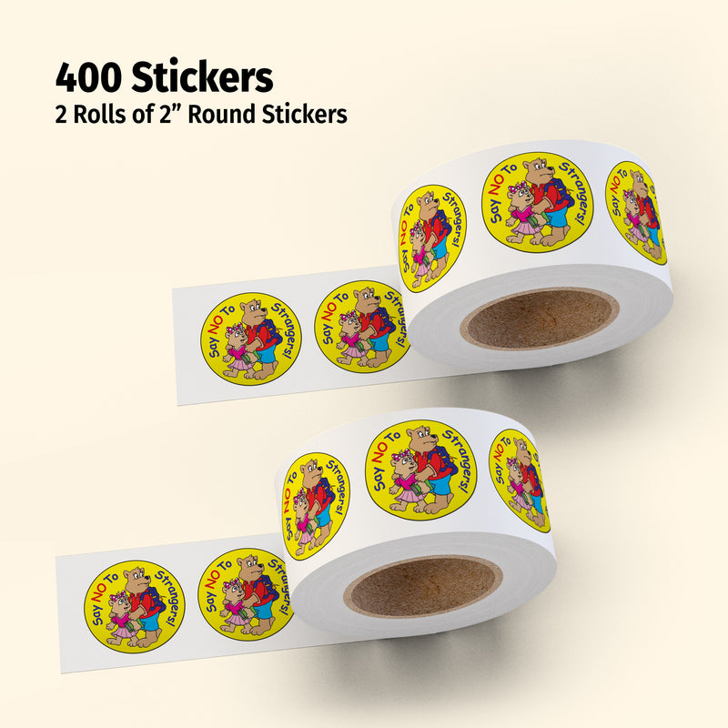 Two rolls of 2-inch round stickers with colorful designs on a beige background.