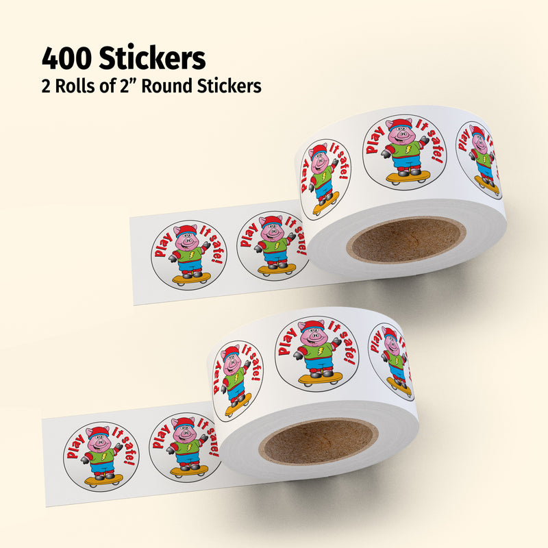 Two rolls of 2-inch round stickers with a character design on a beige background.