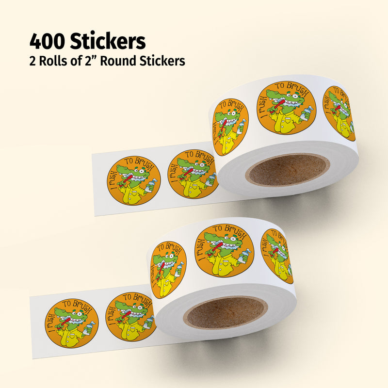 Two rolls of 2-inch round stickers with cartoon frog design on a beige background.