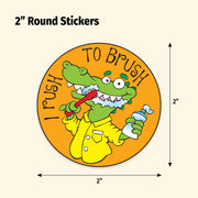 Round sticker with a cartoon crocodile brushing teeth on an orange background, dimensions indicated.