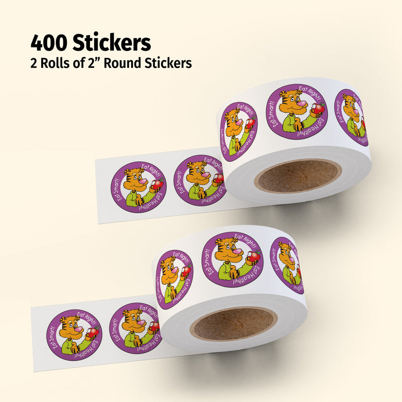 Two rolls of 2-inch round stickers with a cartoon character on a beige background
