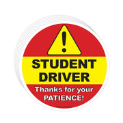 Round sign with 'Student Driver' text and warning triangle on a red and yellow background.
