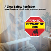 Beware of dog sign in a home setting with a dog visible through a window.